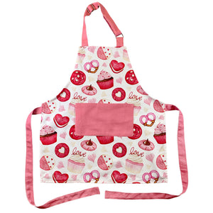 pink and white valentine apron with different cookies and cupcakes