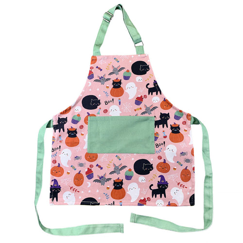 pink and green halloween apron with whimsical spooky characters like bats and ghosts