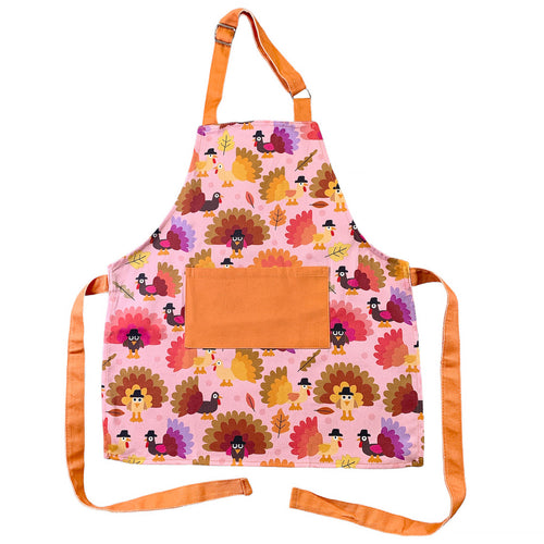 pink and orange children's apron with turkeys