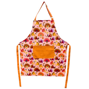 pink and orange apron with turkey print.