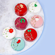 collection of christmas chocolate oreos with royal icing decorations